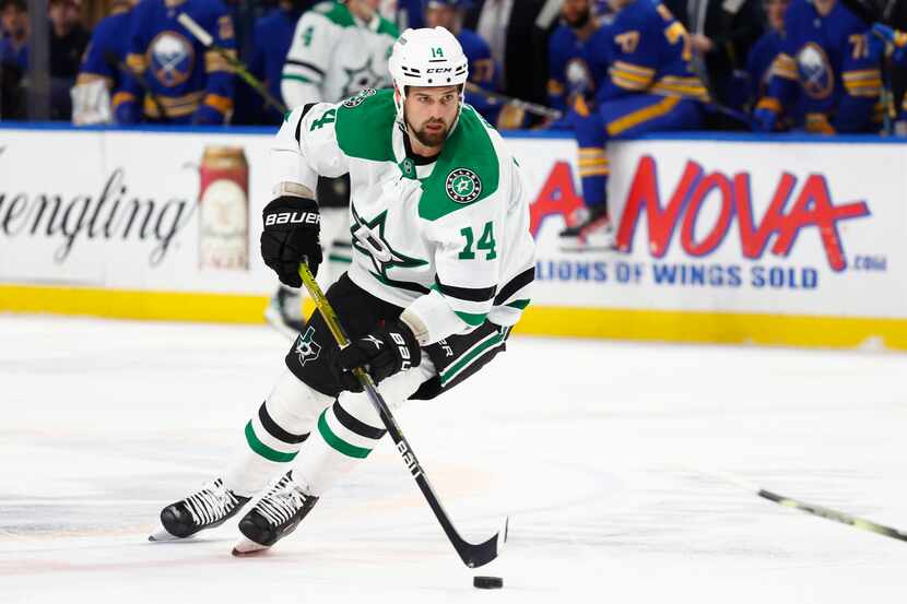 Dallas Stars left wing Jamie Benn carries the puck into the zone during the second period of...