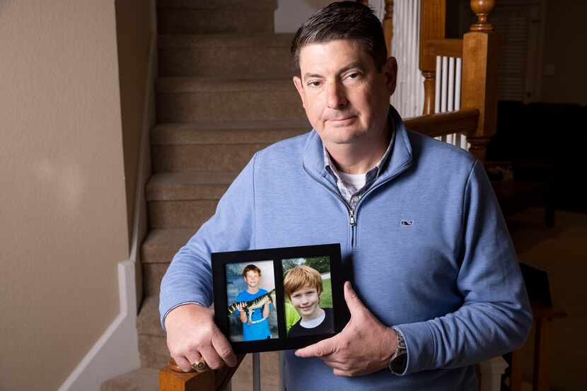 Carson's Village founder Jason Dyke holds family photos of his late son Carson at his home...