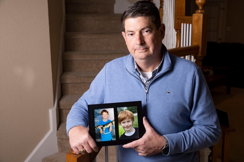 Carson's Village founder Jason Dyke holds family photos of his late son Carson at his home...
