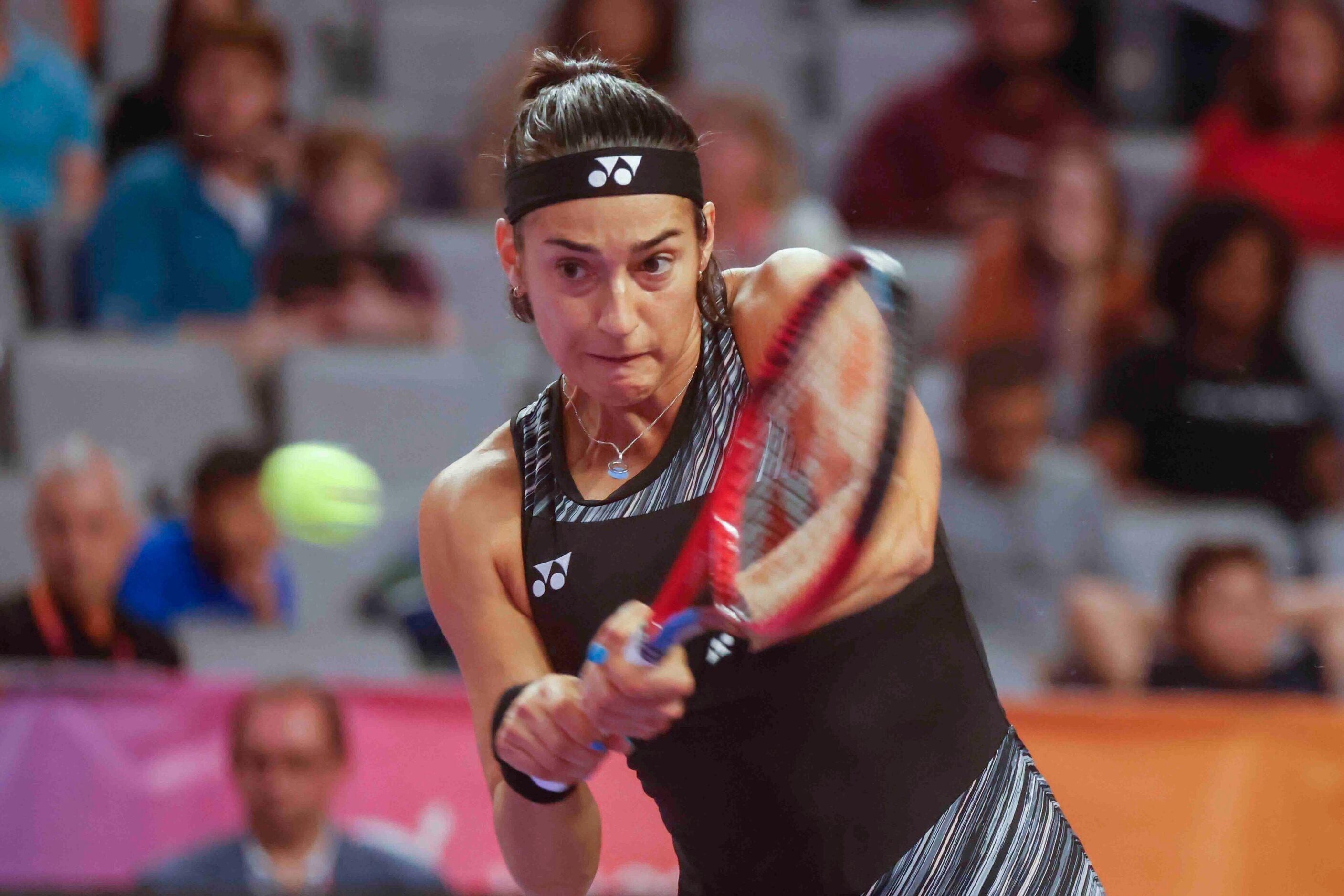 Caroline Garcia of France returns a backhand shot against Coco Gauff of the USA on day two...