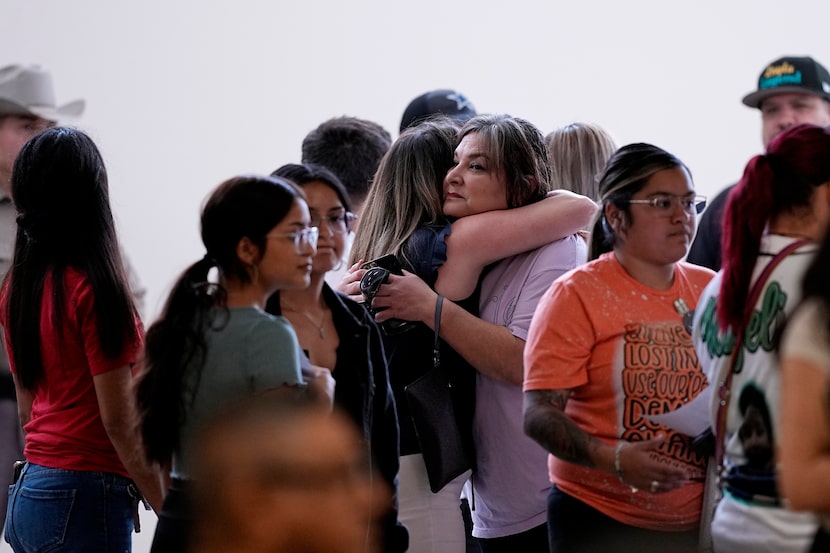 Family members arrive for a special city council meeting in Uvalde, Texas, Thursday, March...