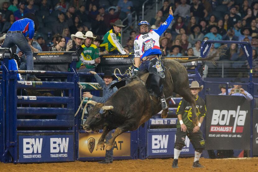Bull rider Keyshawn Whitehorse of Team U.S.A. Wolves rides Magic Train during the PBR Global...