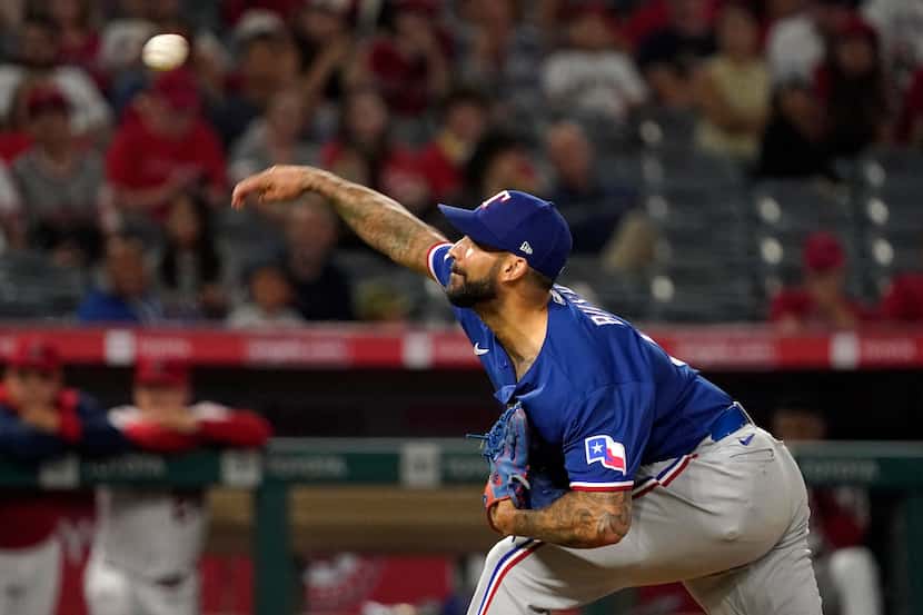 Texas Rangers relief pitcher Matt Bush throws to the plate during the ninth inning of a...