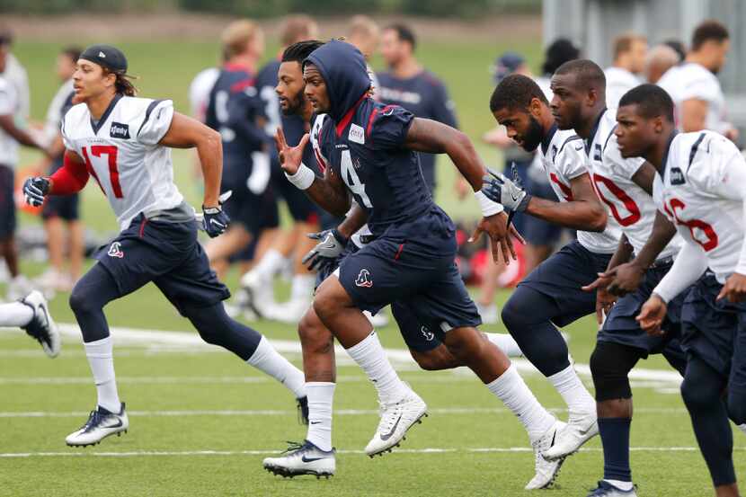 Houston Texans quarterback Deshaun Watson (4) and teammates run the field during practice at...