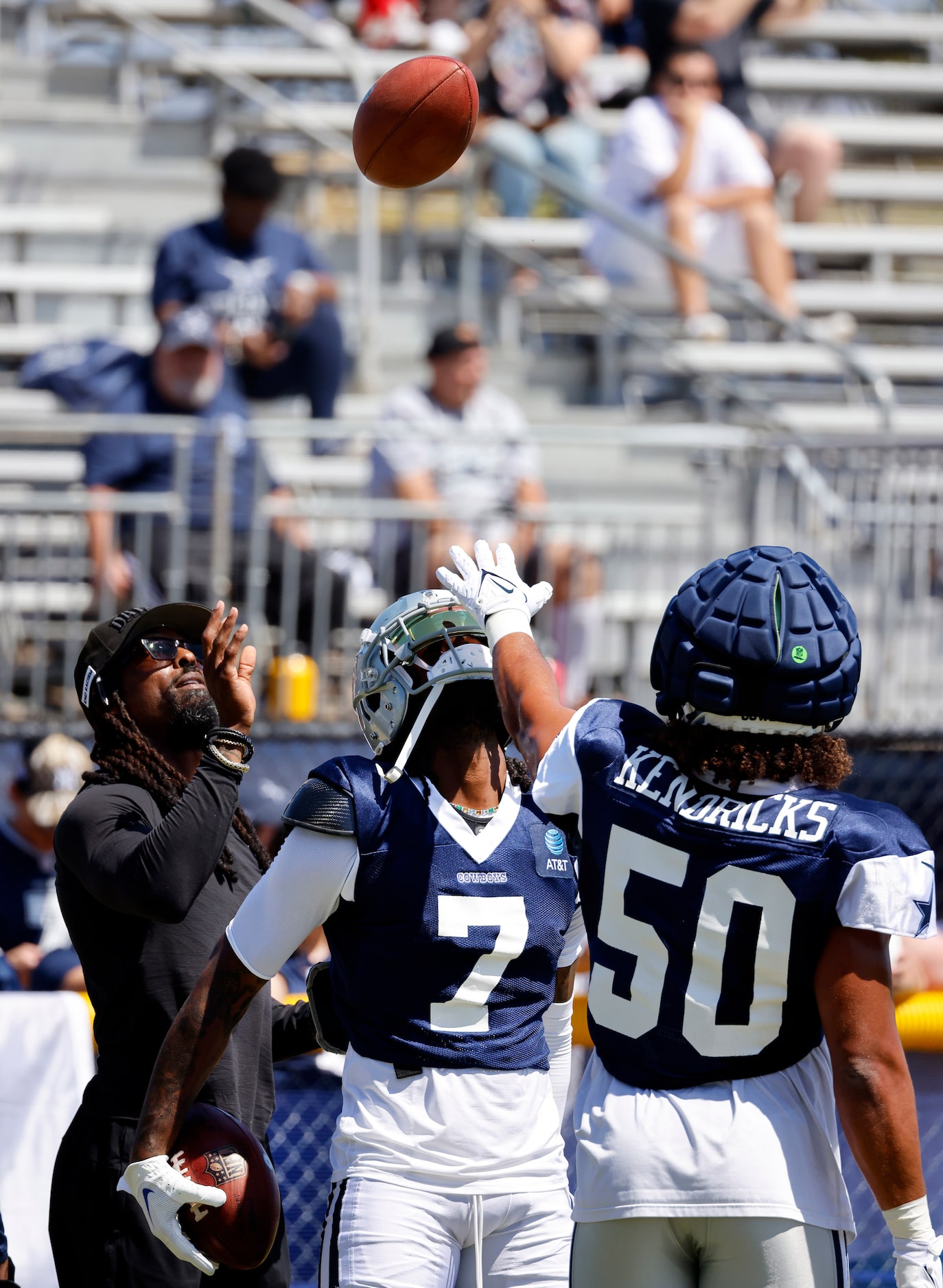 Dallas Cowboys cornerback Trevon Diggs (7) looks for a football being tossed by defensive...