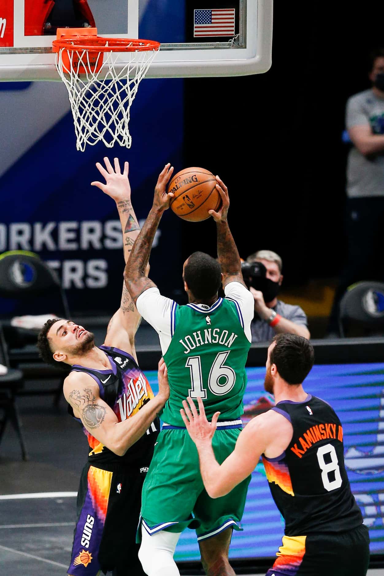 Dallas Mavericks forward James Johnson (16) attempts a shot as Phoenix Suns forwards Abdel...