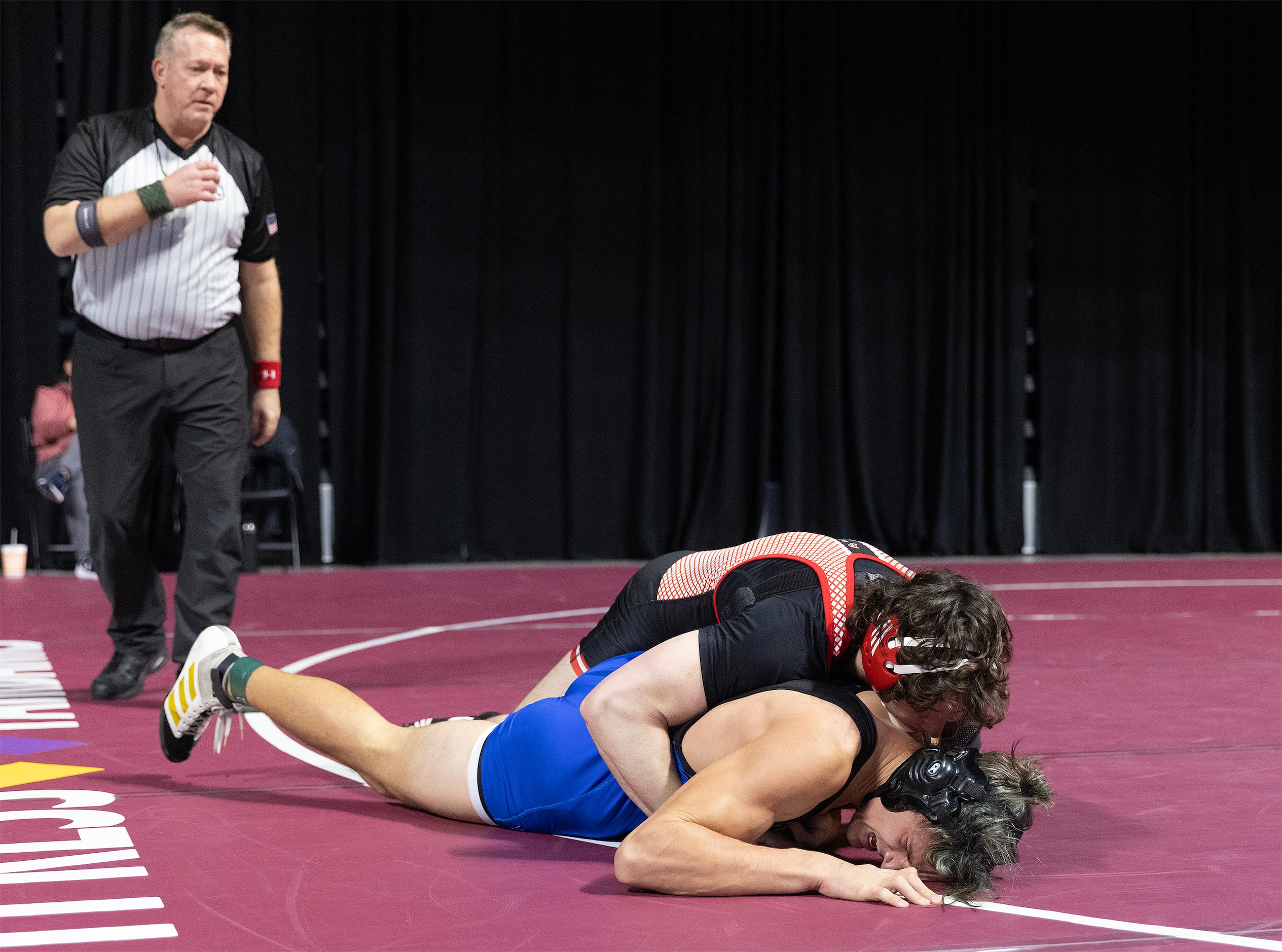 Payton Pierce from Lovejoy (top) wrestles Jack Ashley from Midlothian in the 5A boys 215...