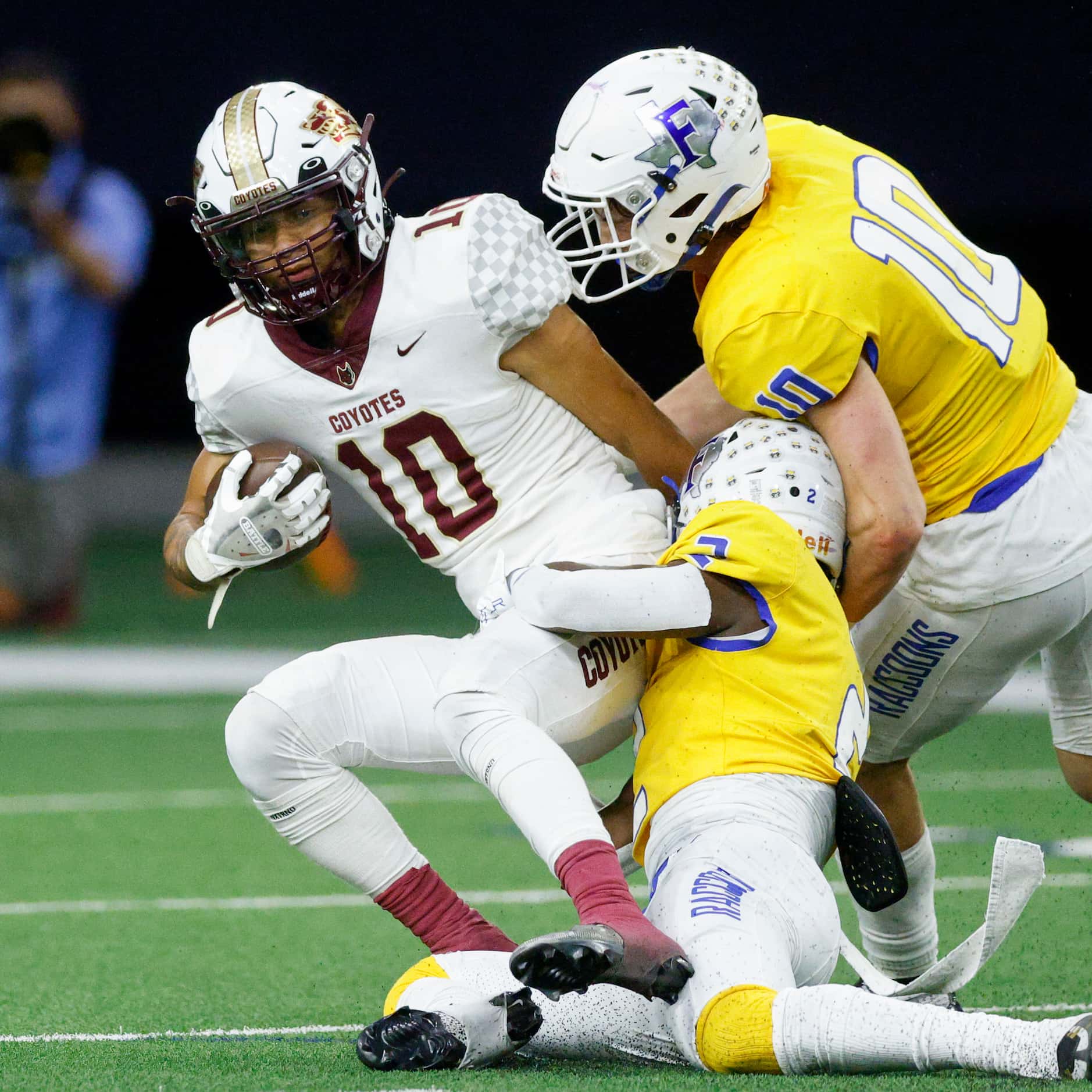Frisco defensive backs Reed Engleman (10) and Ismael Taylor (2) tackle Frisco Heritage wide...