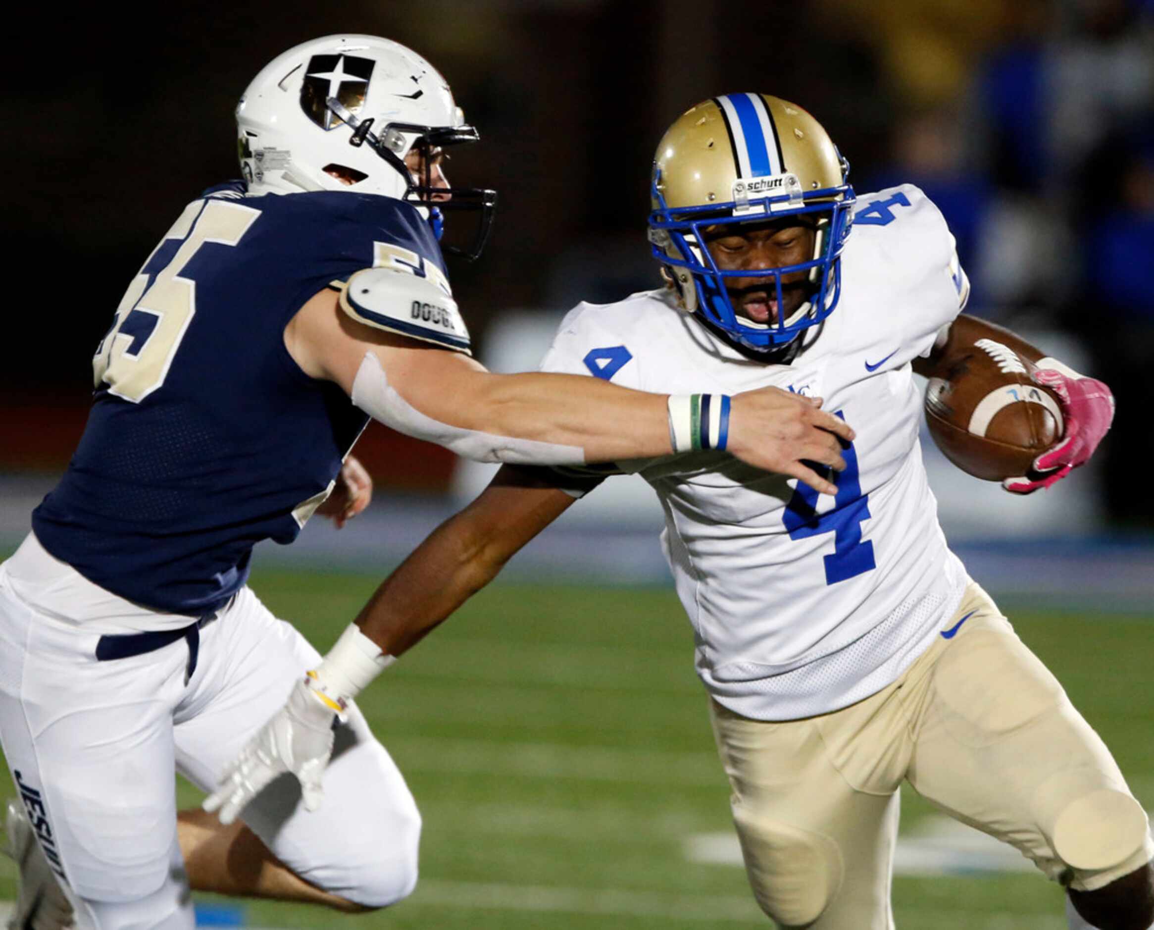 Lakeview RB Camar Wheaton (4) can't get by Jesuit LB  Tommy Roy (55) during the first half...