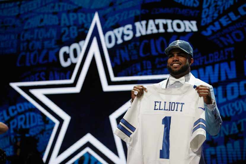 CHICAGO, IL - APRIL 28:  Ezekiel Elliott of Ohio State holds up a jersey after being picked...