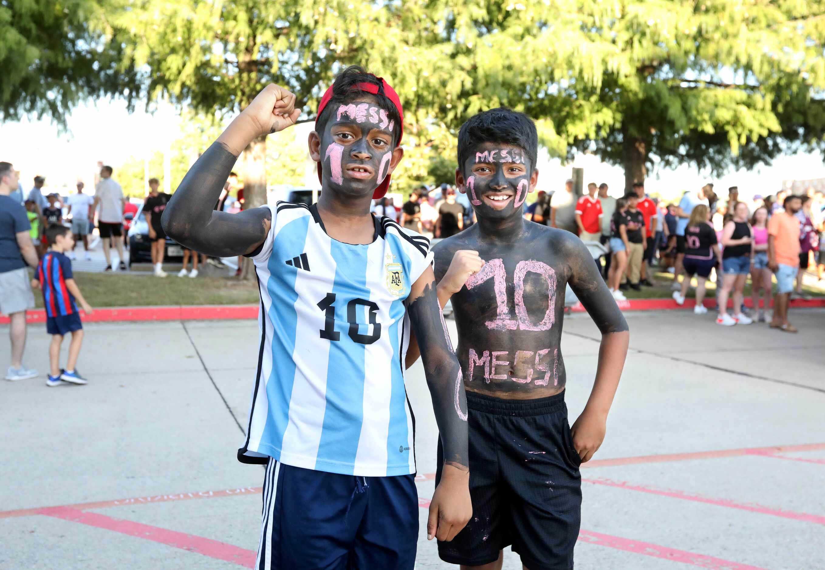 9-year-old Adhvik Dhandapani, left, and 8-year-old Advik Ramesh cheer as they wait for the...