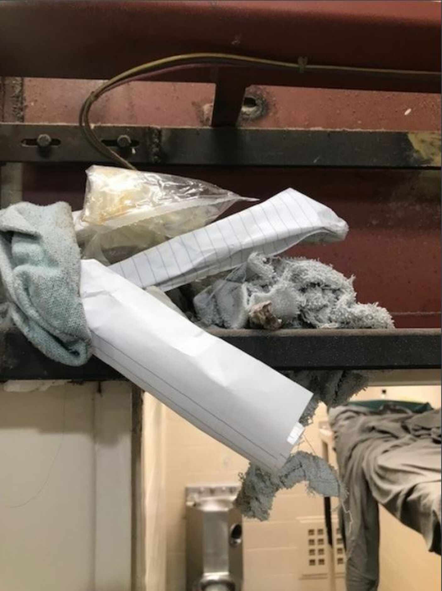 Paper and rags that were jammed into a cell door mechanism overhead. County staff removed...