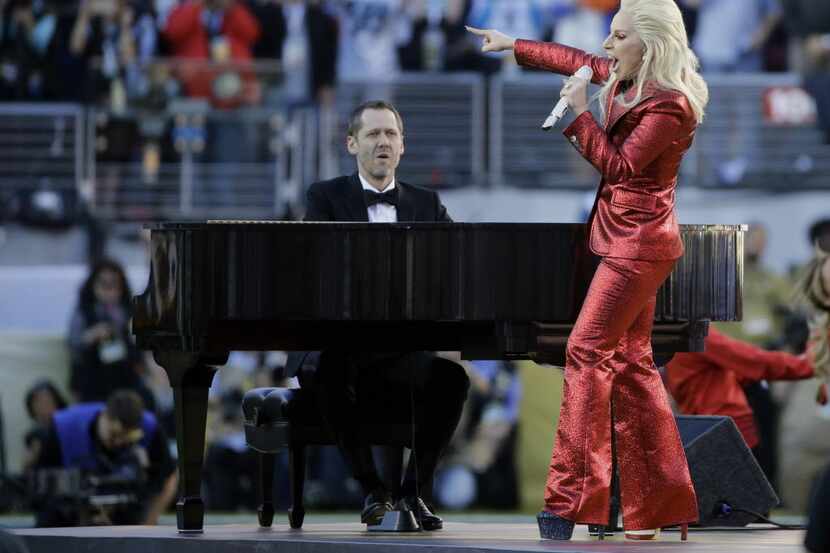 Lady Gaga sings the national anthem before the NFL Super Bowl 50 football game between the...