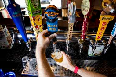 Bartender Greg Miller pours a glass of Rollertown Beerworks’ new kolsch beer at Chili's in...