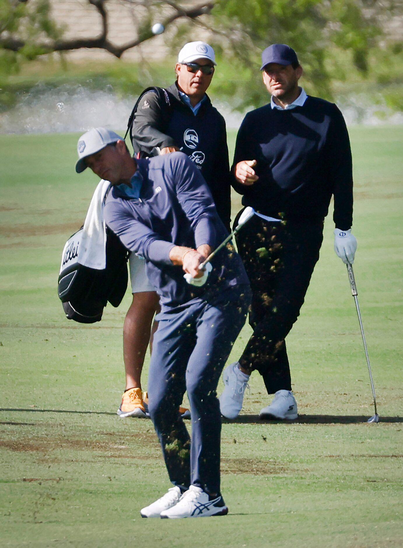 Former Dallas Cowboys quarterback Tony Romo (right) watches as former Dallas Stars player...