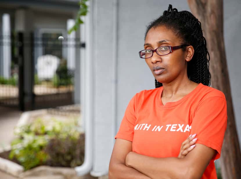 Latosha Lewis, one of nearly 4.3 million people of color with medical debt in Texas, poses...