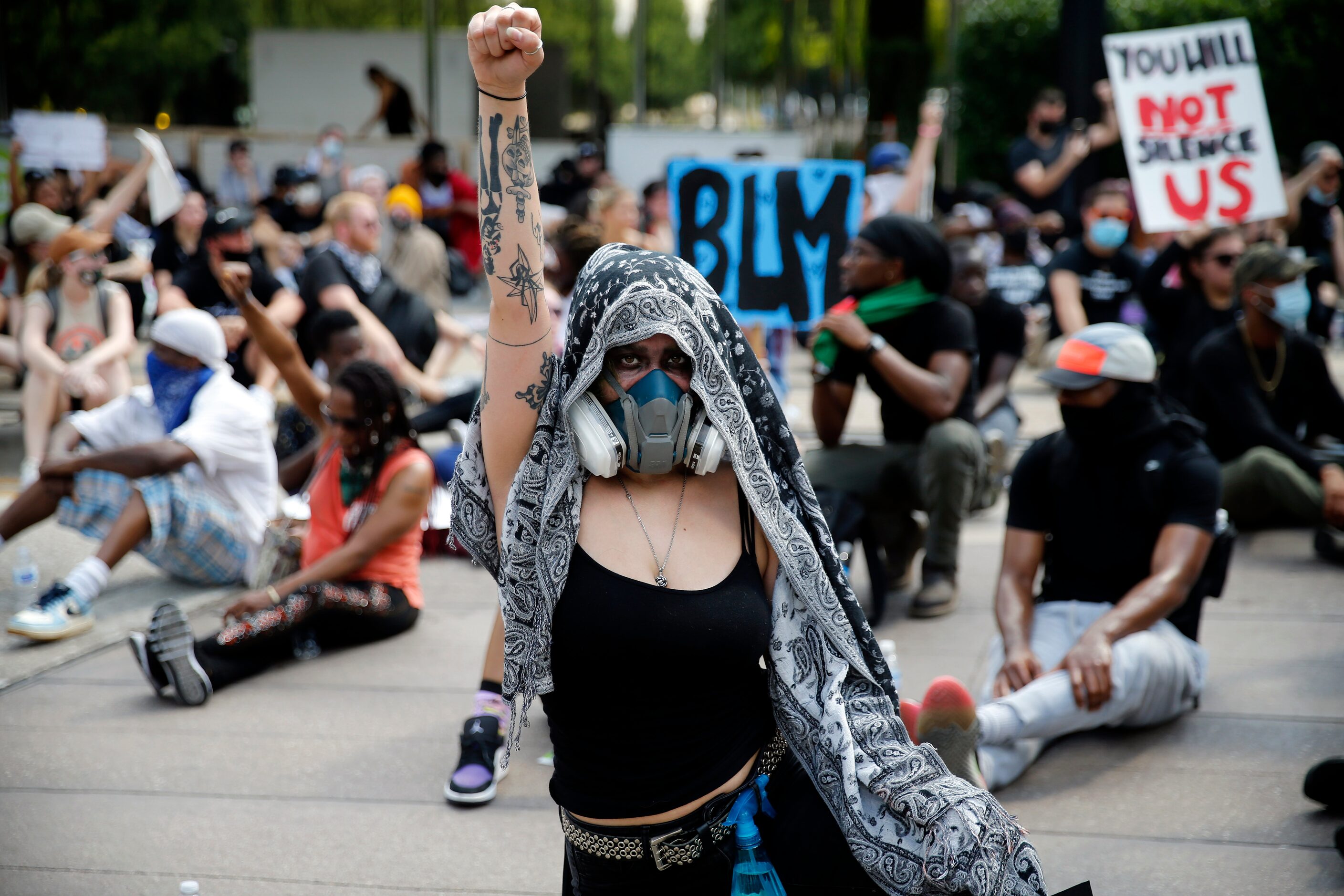 Protestors supporting Black Lives Matters block an intersection at Klyde Warren Park for 8...