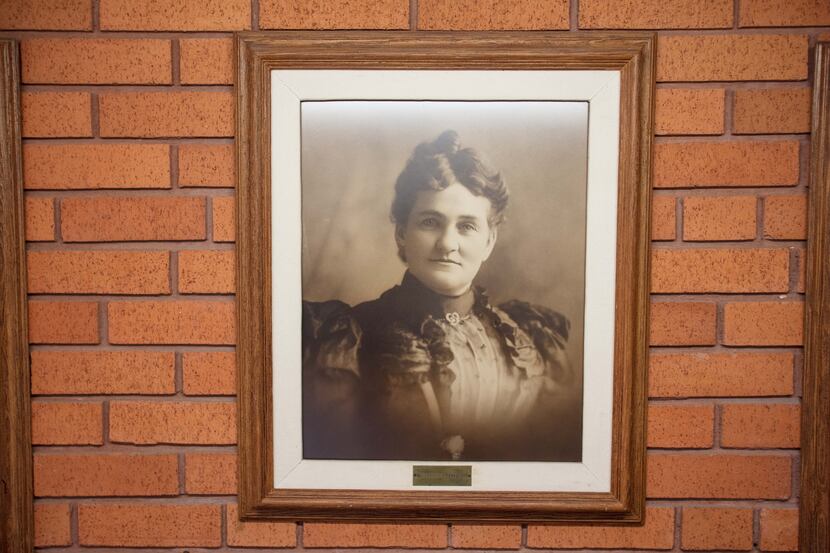 A portrait of Lydia Patterson hangs at the school. In 1906, Patterson set up day classes for...