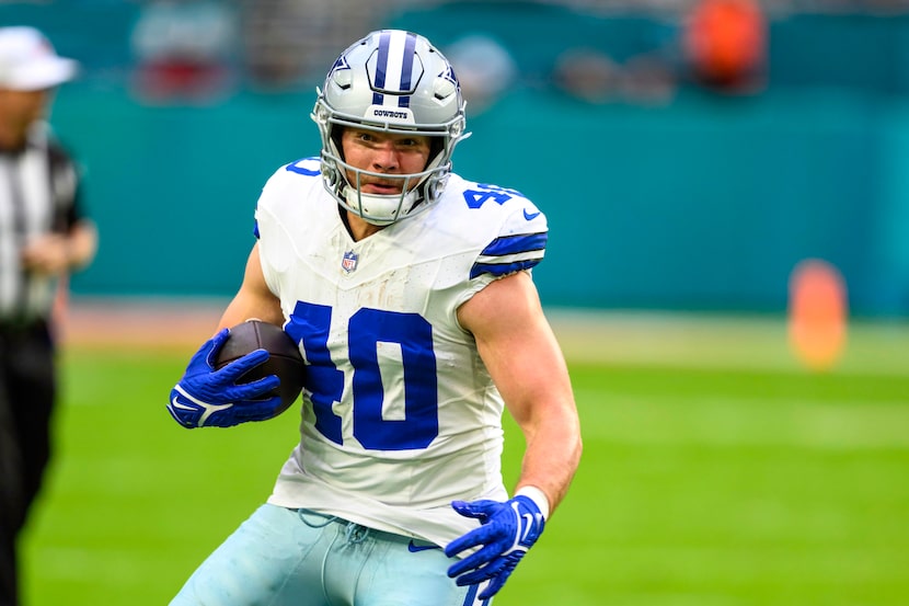 Dallas Cowboys running back Hunter Luepke (40) runs with the ball during an NFL football...