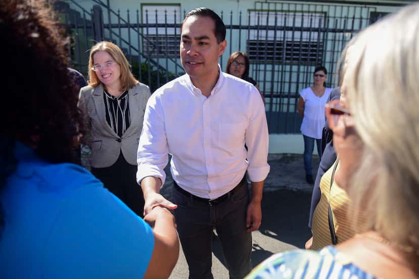 Julian Castro greets residents in Playita, one of the poorest and most affected communities...