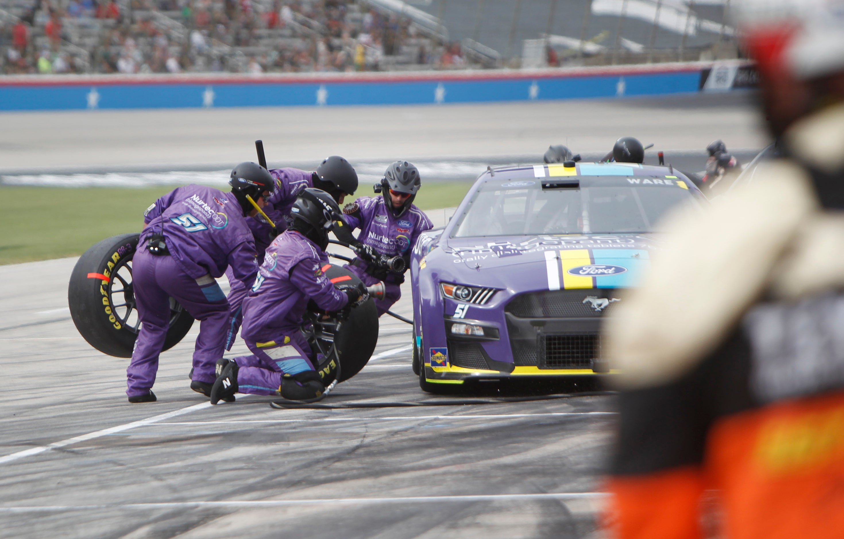 Cody Ware, driver of the #51 Nurtec ODT Ford car, takes a short pit break as his crew...