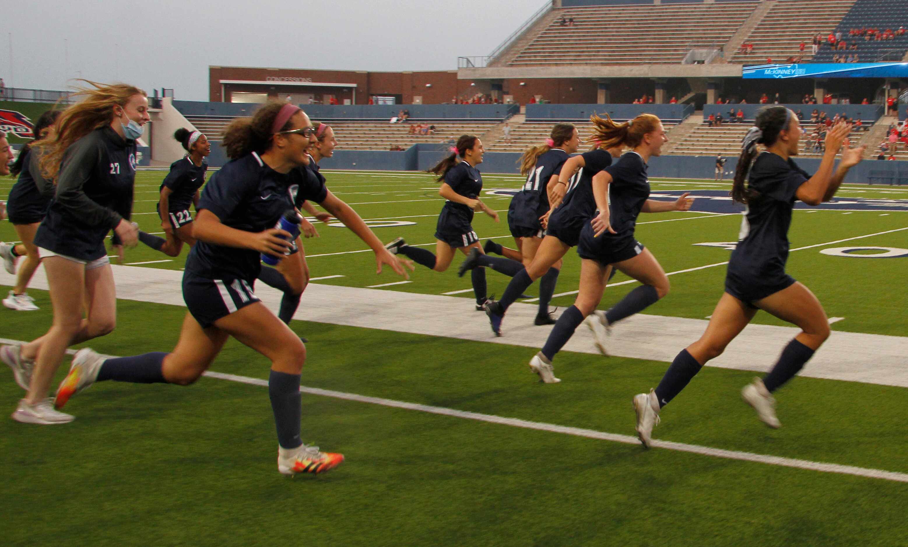 Flower Mound players bolt onto the field at the sound of the buzzer as they defeated Flower...