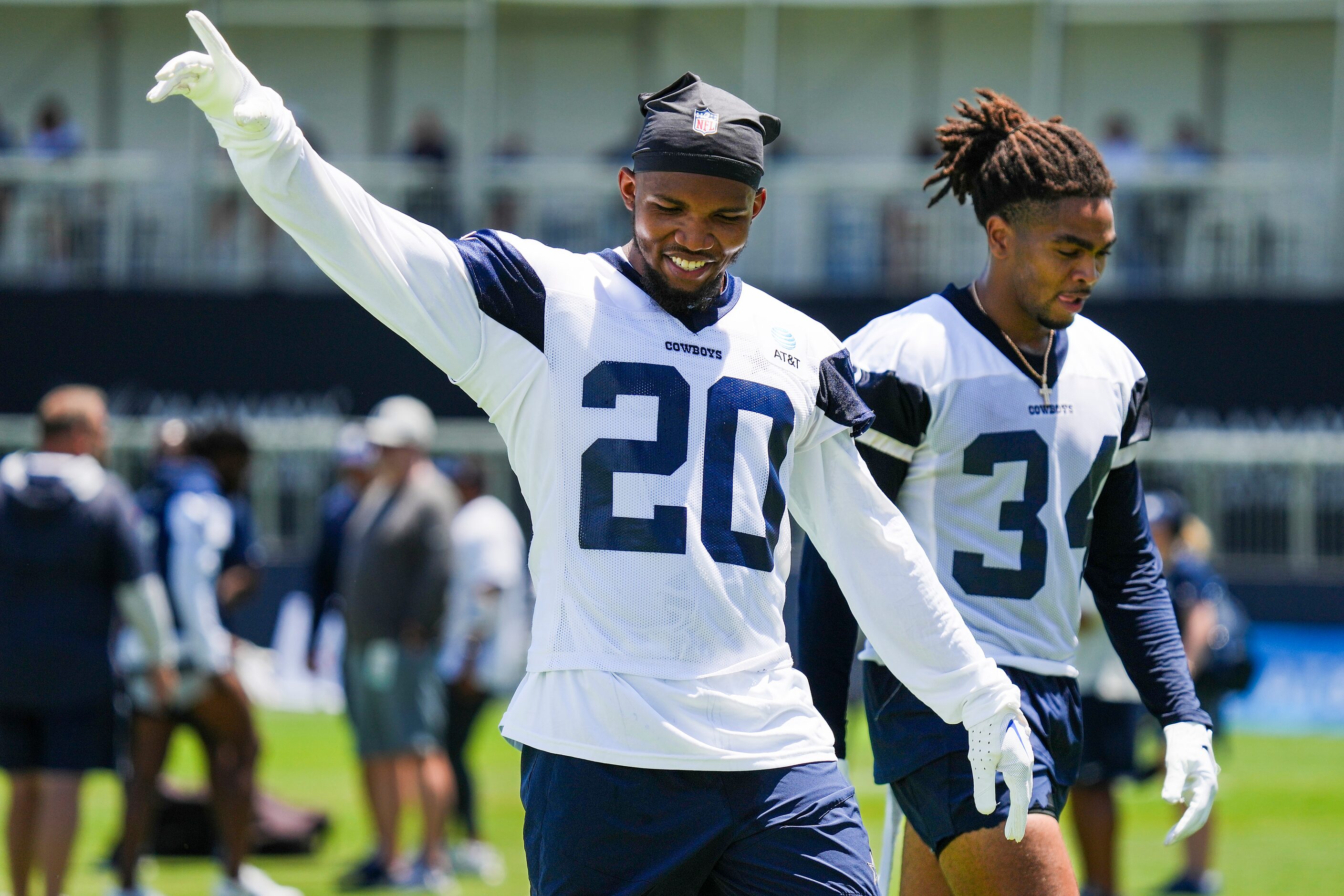 Dallas Cowboys running back Tony Pollard (20) gestures toward fans as he leaves the field...