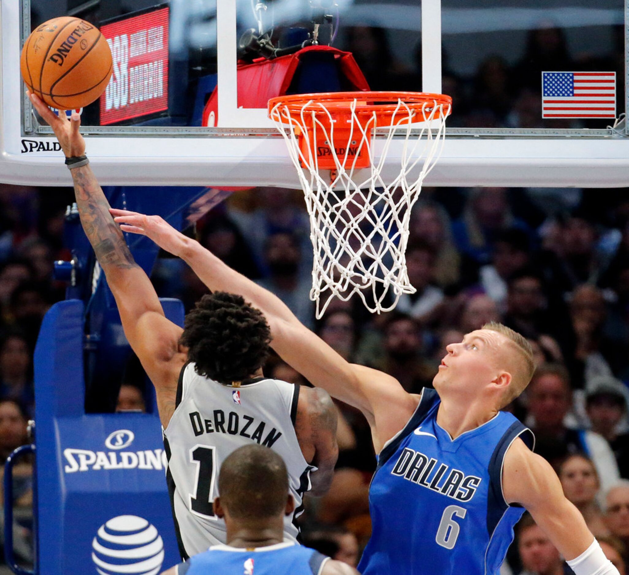 Dallas Mavericks forward Kristaps Porzingis (6) attempts to block San Antonio Spurs guard...