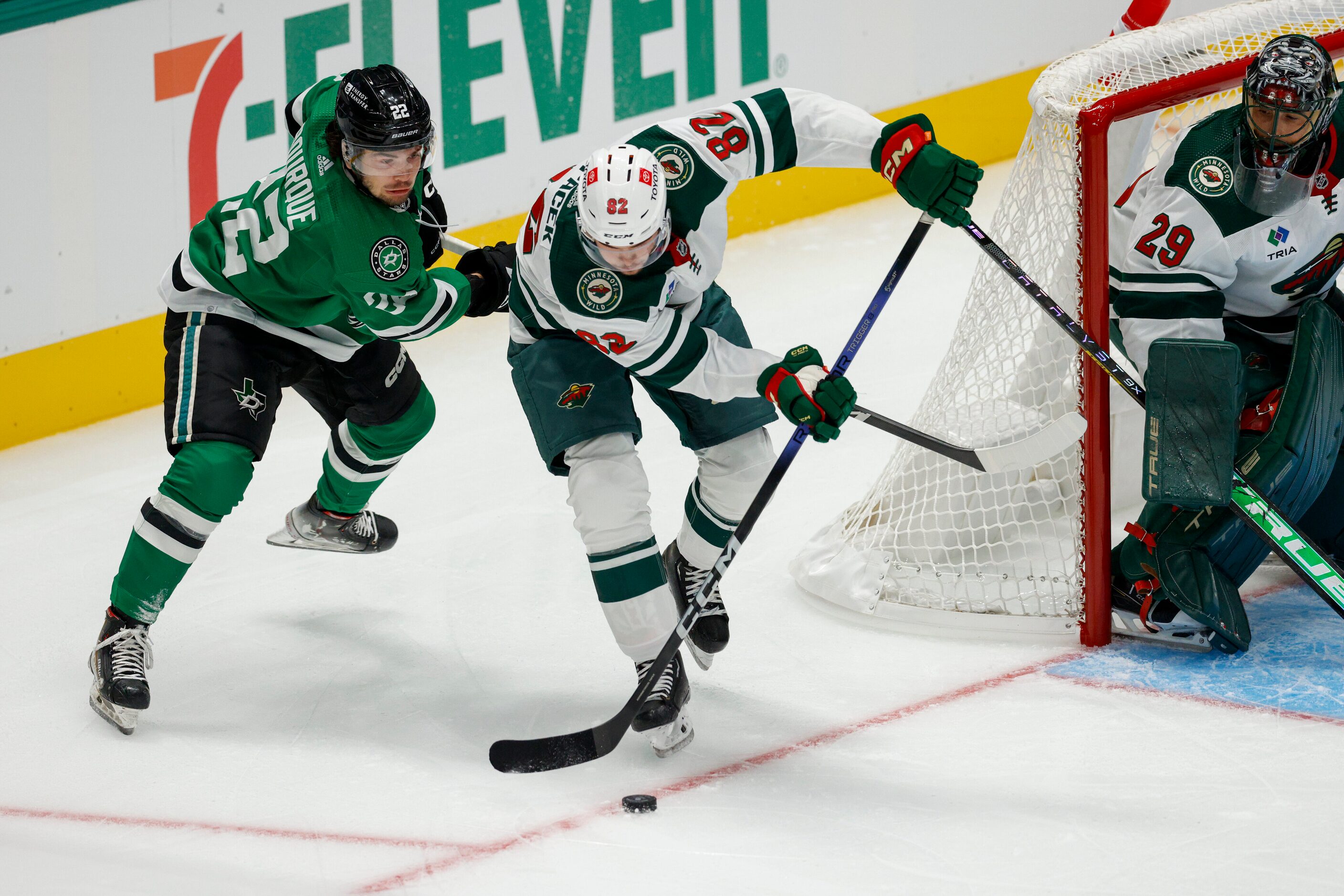 Minnesota Wild defenseman David Spacek (82) clears the puck away form Dallas Stars center...