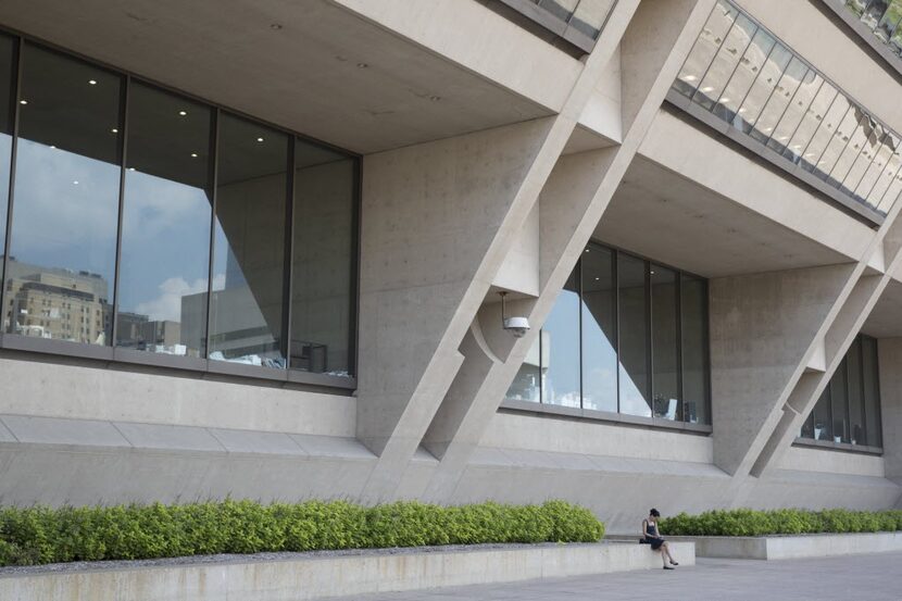 A person sits outside the Dallas City Hall on Aug. 31, 2016 in Dallas. (Ting Shen/The Dallas...