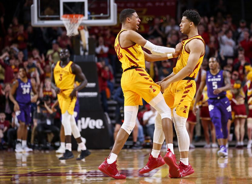 Iowa State guard Tyrese Haliburton, center, pushes Iowa State guard Lindell Wigginton as...