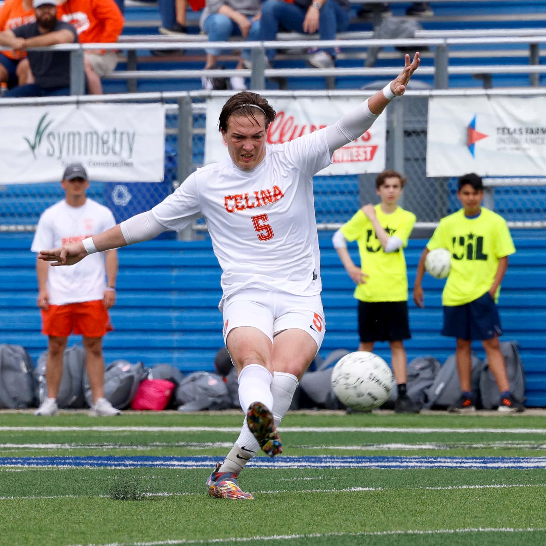 Celina forward Seth Brown (5) takes a shot during the first half of the Class 4A boys soccer...