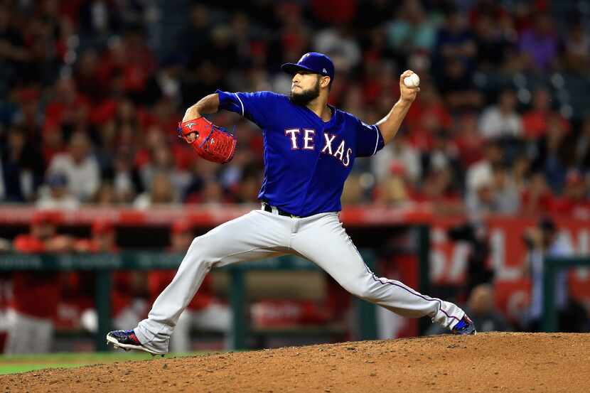 ANAHEIM, CA - AUGUST 24:  Martin Perez #33 of the Texas Rangers pitches during the seventh...