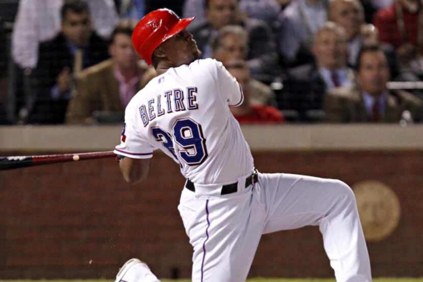 Adrian Beltre goes down on one knee after belting a tying home run in Game 5 of the World...