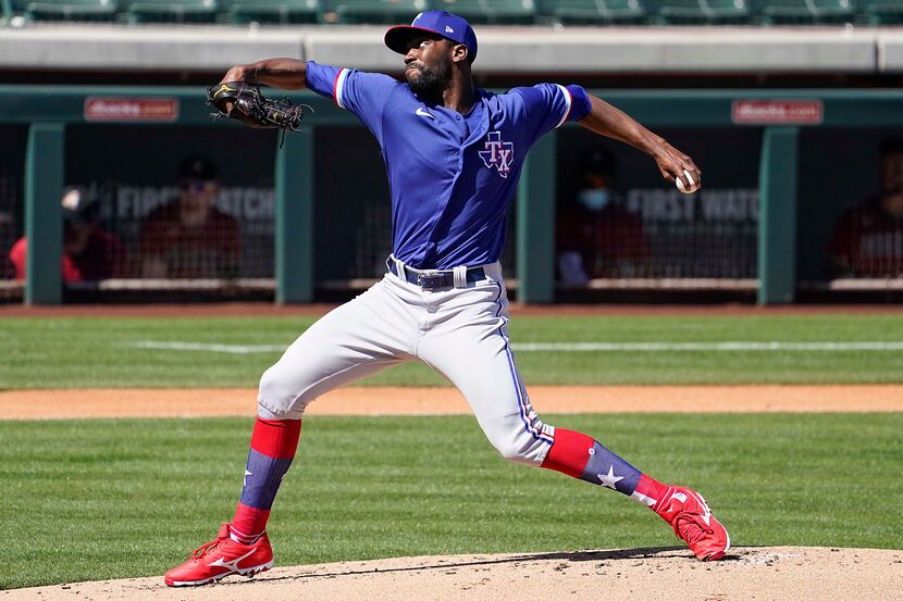 Texas Rangers pitcher Taylor Hearn delivers during the first inning of a spring training...