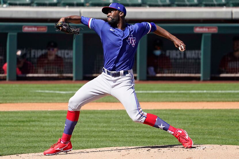 Texas Rangers pitcher Taylor Hearn delivers during the first inning of a spring training...