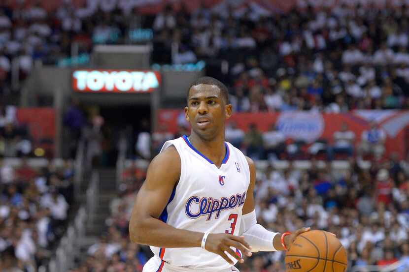 Los Angeles Clippers guard Chris Paul drives toward the basket during the first half of...
