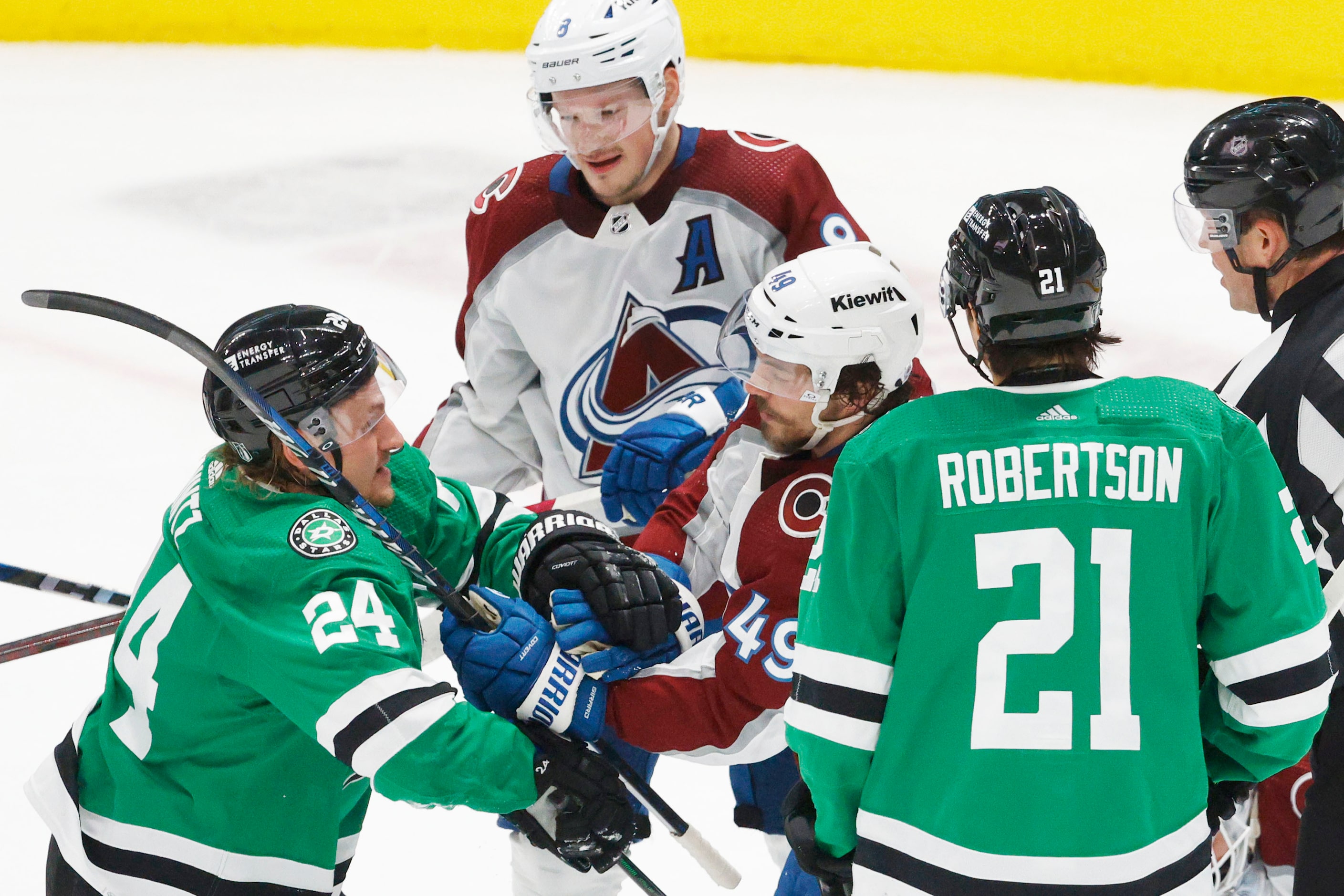 Dallas Stars center Roope Hintz (24) fights with Colorado Avalanche defenseman Samuel Girard...