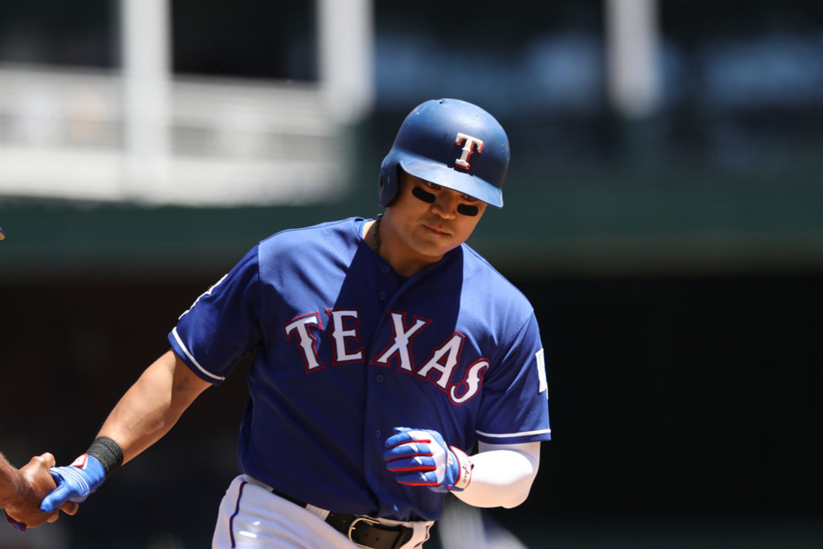 ARLINGTON, TEXAS - MAY 19: Shin-Soo Choo #17 of the Texas Rangers runs the bases after...