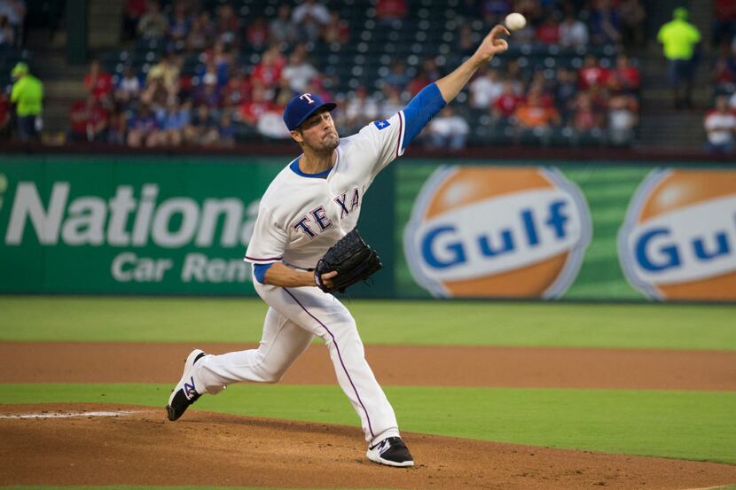 Texas Rangers starting pitcher Cole Hamels (35) pitches in the top of the first inning...