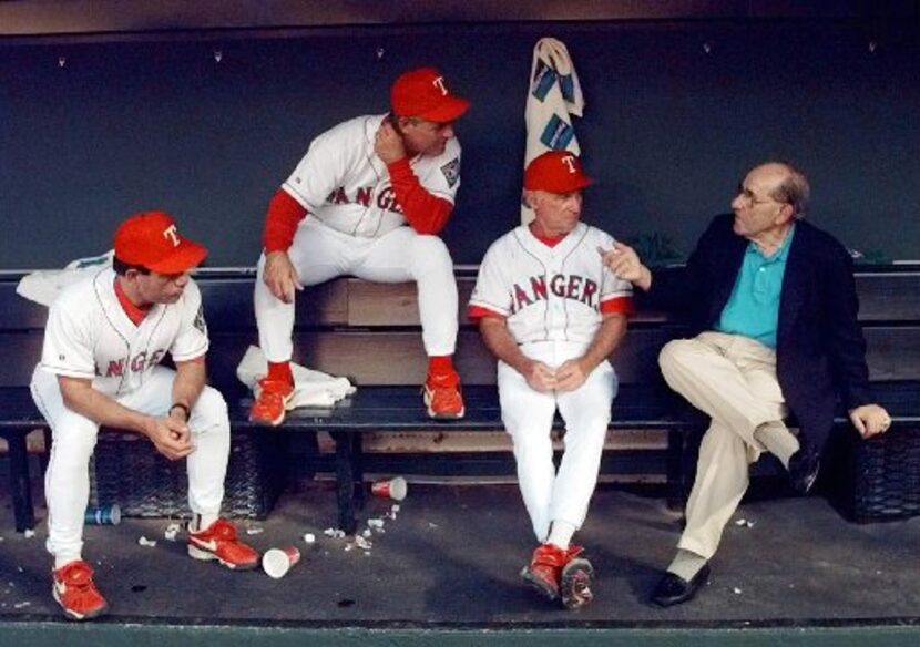 ORG XMIT: ARL103 New York Yankees hall-of-famer Yogi Berra, right, holds court with Texas...