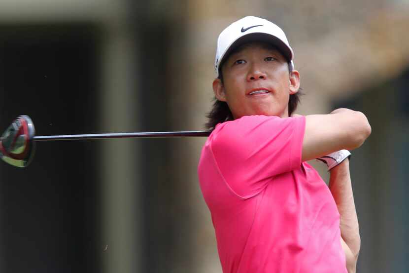 Anthony Kim watches his tee shot on the fourth hole during the final round of the Greenbrier...
