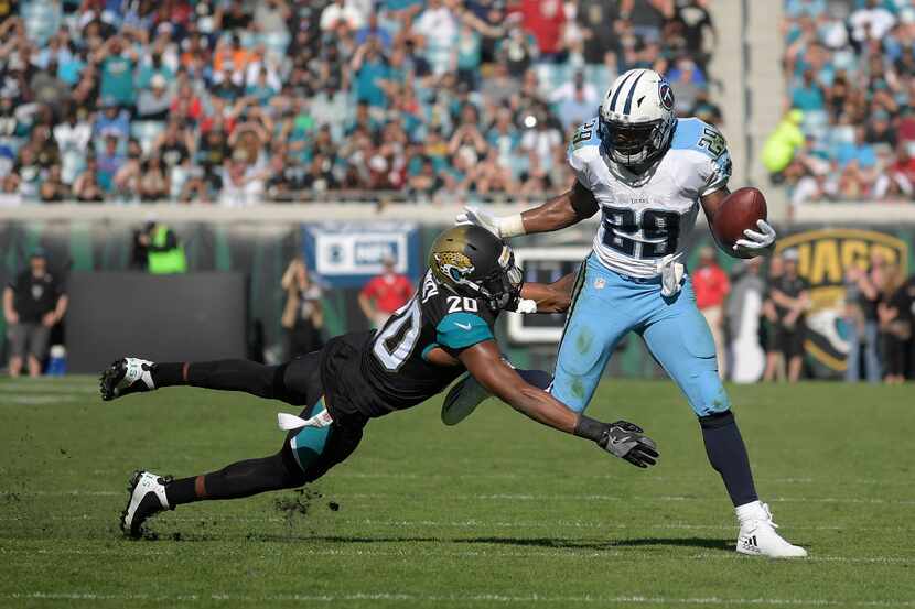 Tennessee Titans running back DeMarco Murray (29) rushes for yardage in front of...