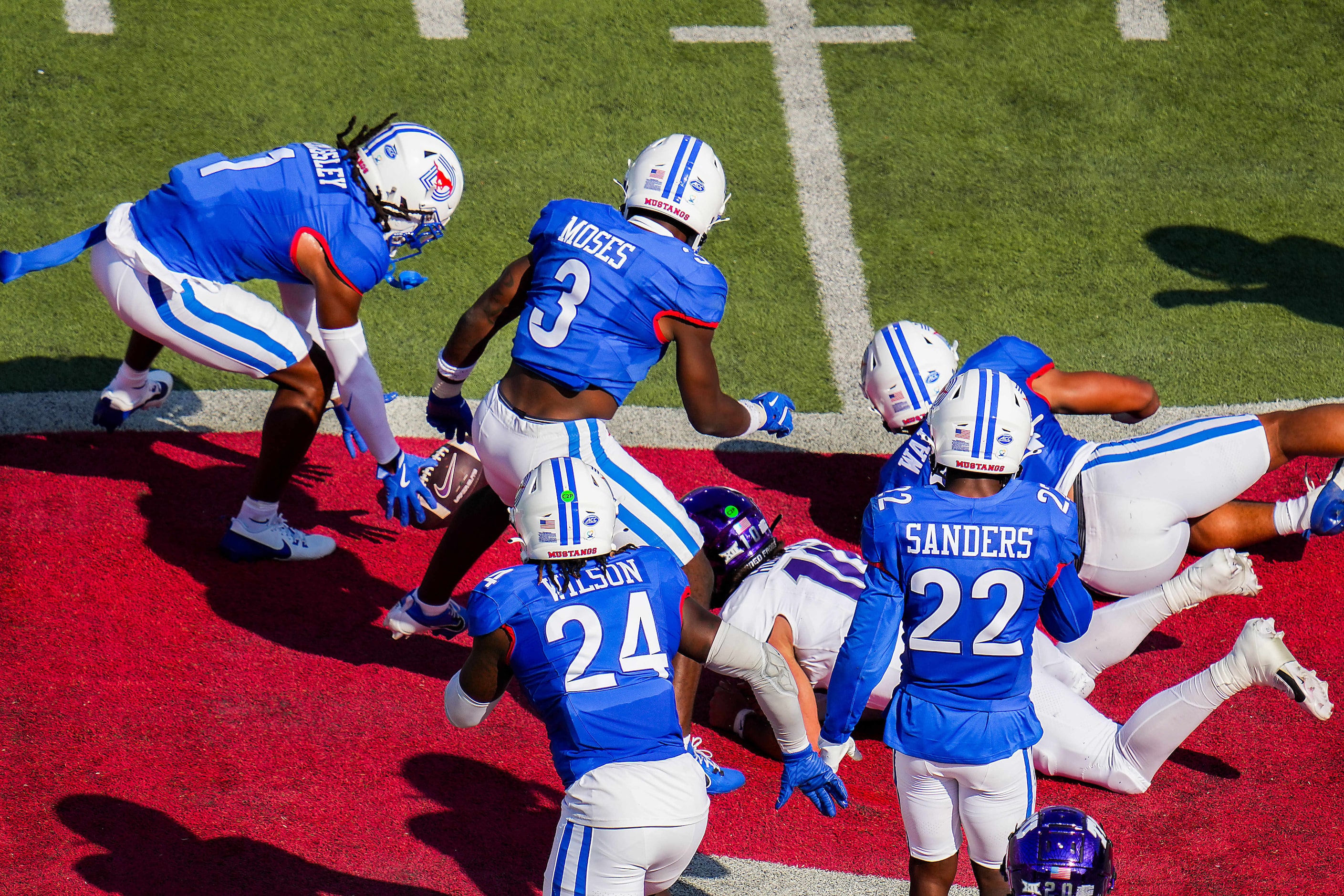 SMU safety Brandon Crossley (1) recovers a fumble by TCU quarterback Josh Hoover (10) and...