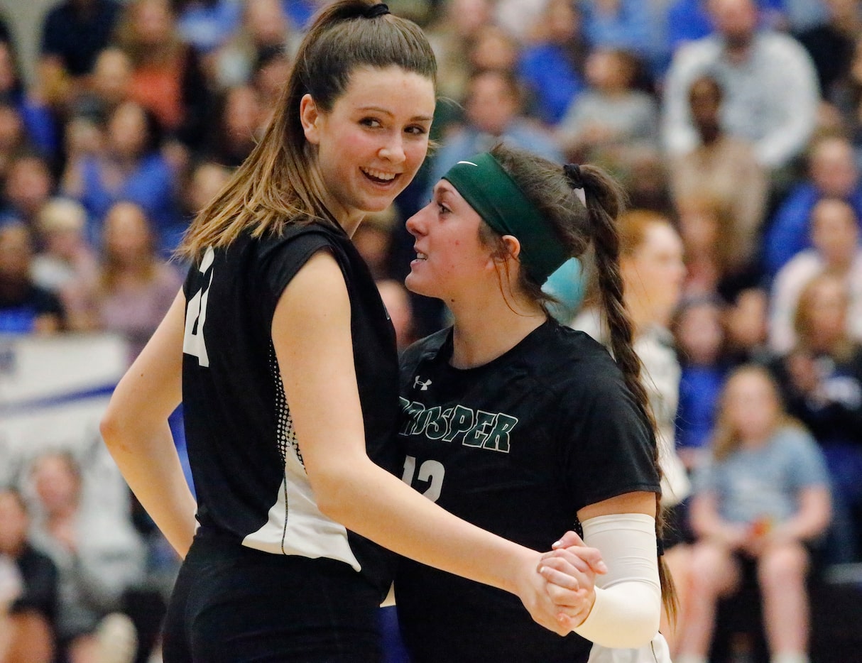 Prosper High School middle Ayden Ames (21) and Prosper High School outside hitter Allie...