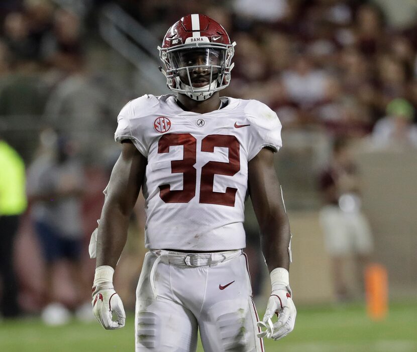 FILE - In this Oct. 7, 2017, file photo, Alabama linebacker Rashaan Evans (32) lines up...