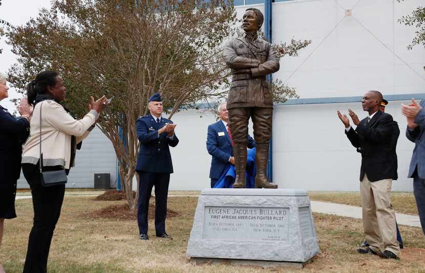 Harriett Bullard White (far left) and William Bullard (far right)  join in applause  after...