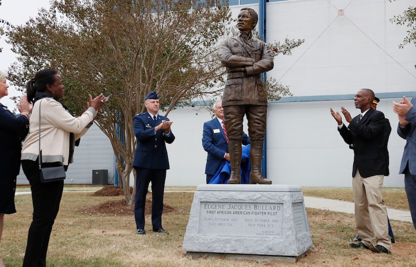 Harriett Bullard White (far left) and William Bullard (far right)  join in applause  after...