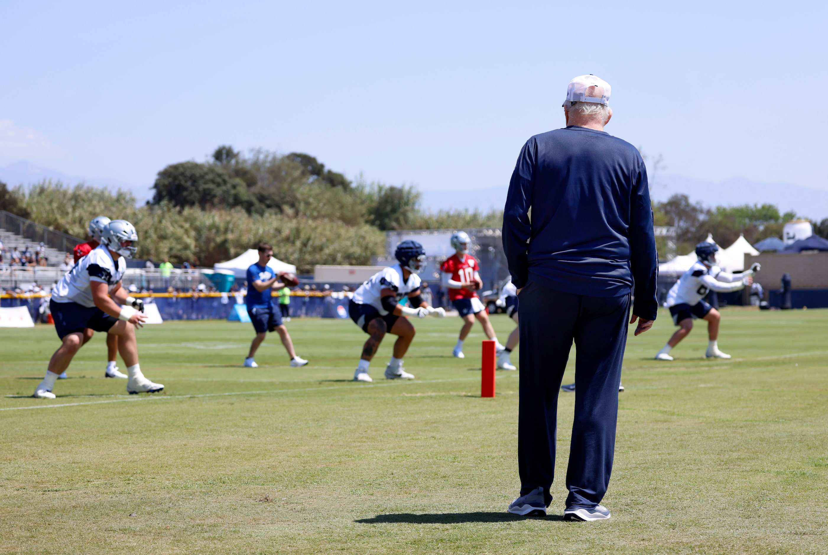 Dallas Cowboys owner Jerry Jones watches his team practice during a training camp session in...