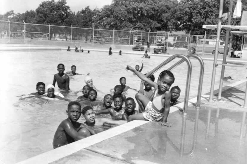  Kids played in the pool at Exline Park in South Dallas in the 1950s. The park became...